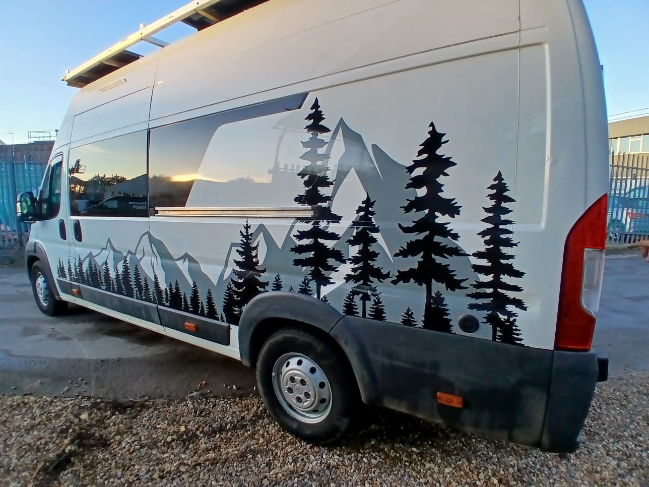 Rear view of campervan woodland wrap