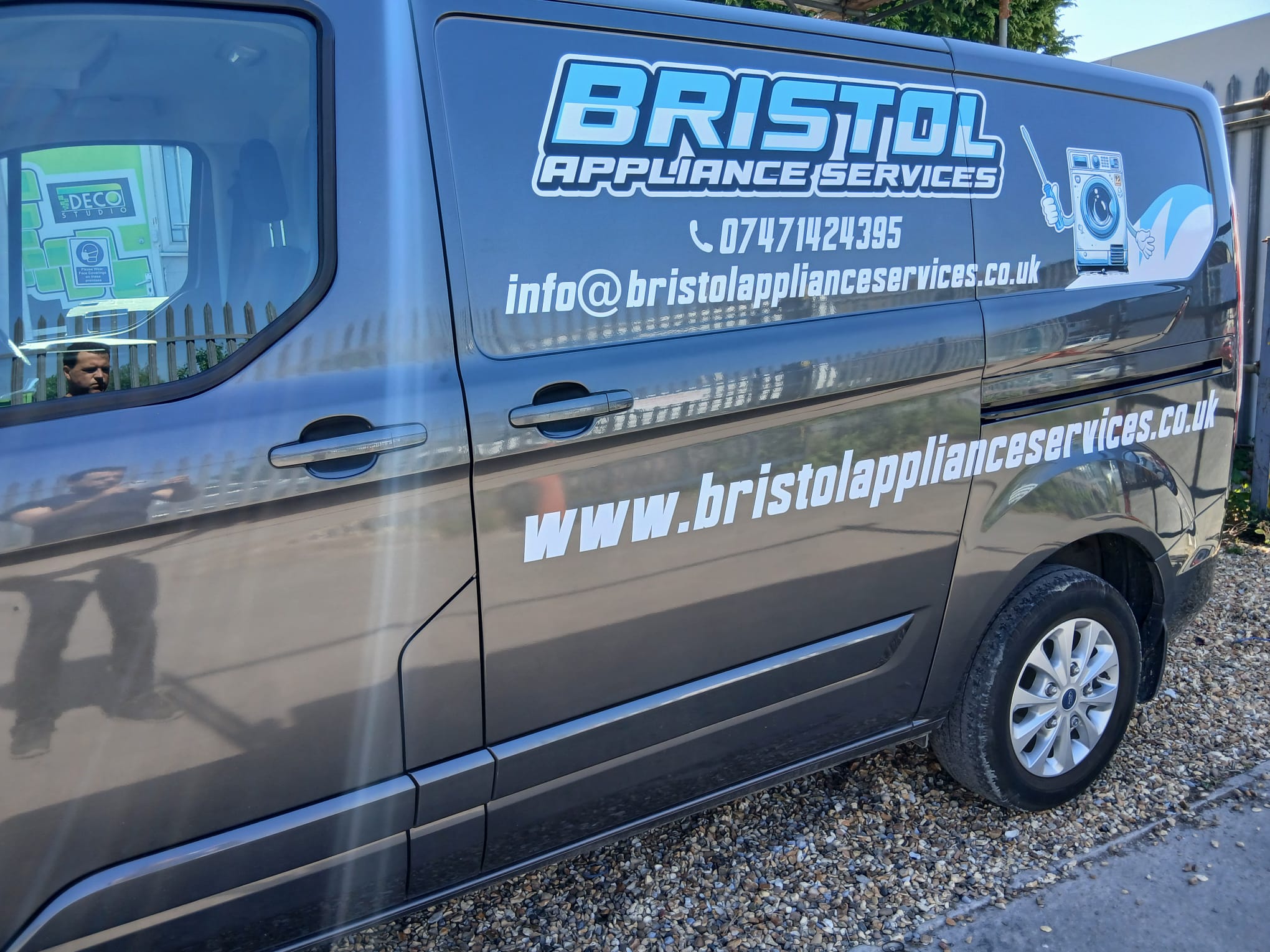 Grey Ford Transit Custom with Bristol Appliance Services van graphics fitted outside Deco Studio Bristol signwriting workshop