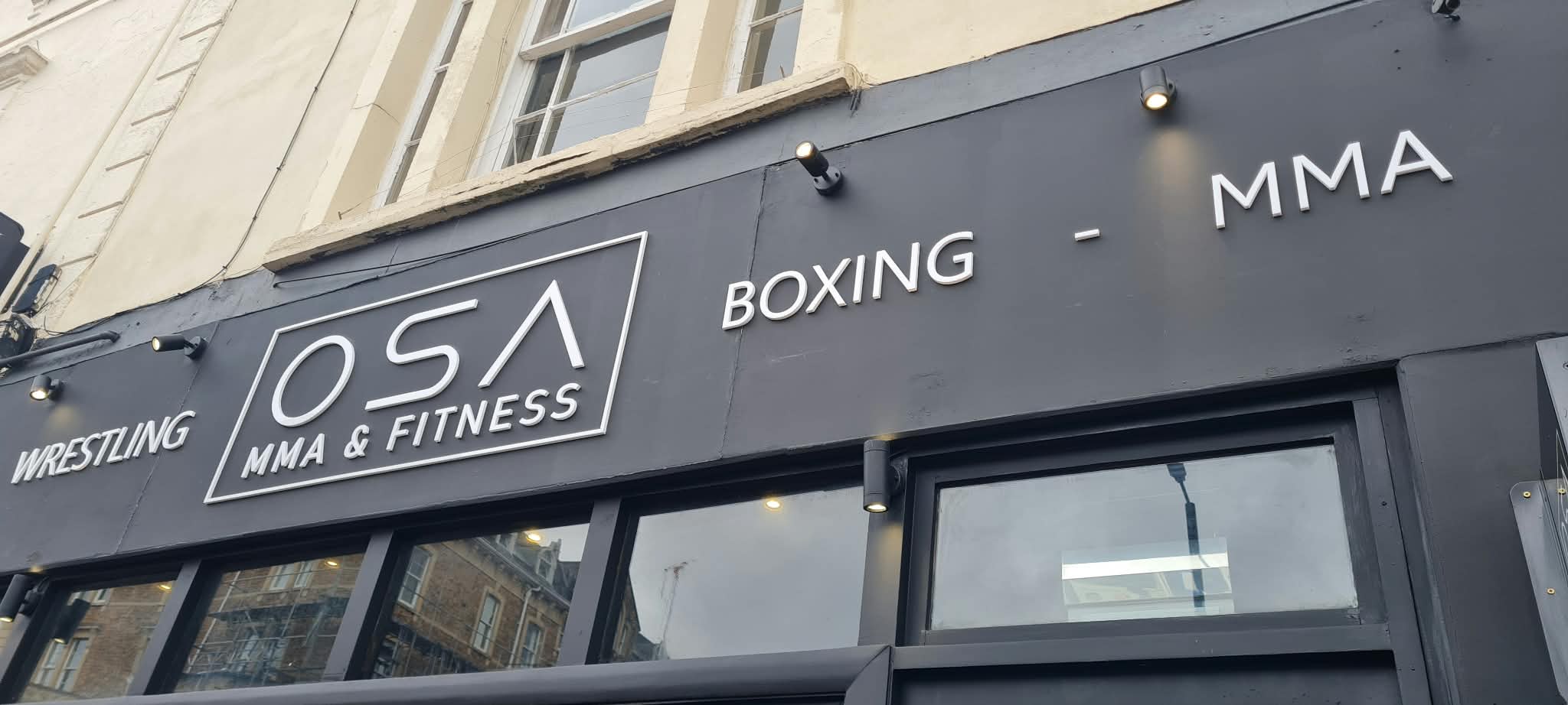 Close-up of raised white acrylic lettering shop sign for OSA MMA & Fitness gym, Bristol, by Deco Studio